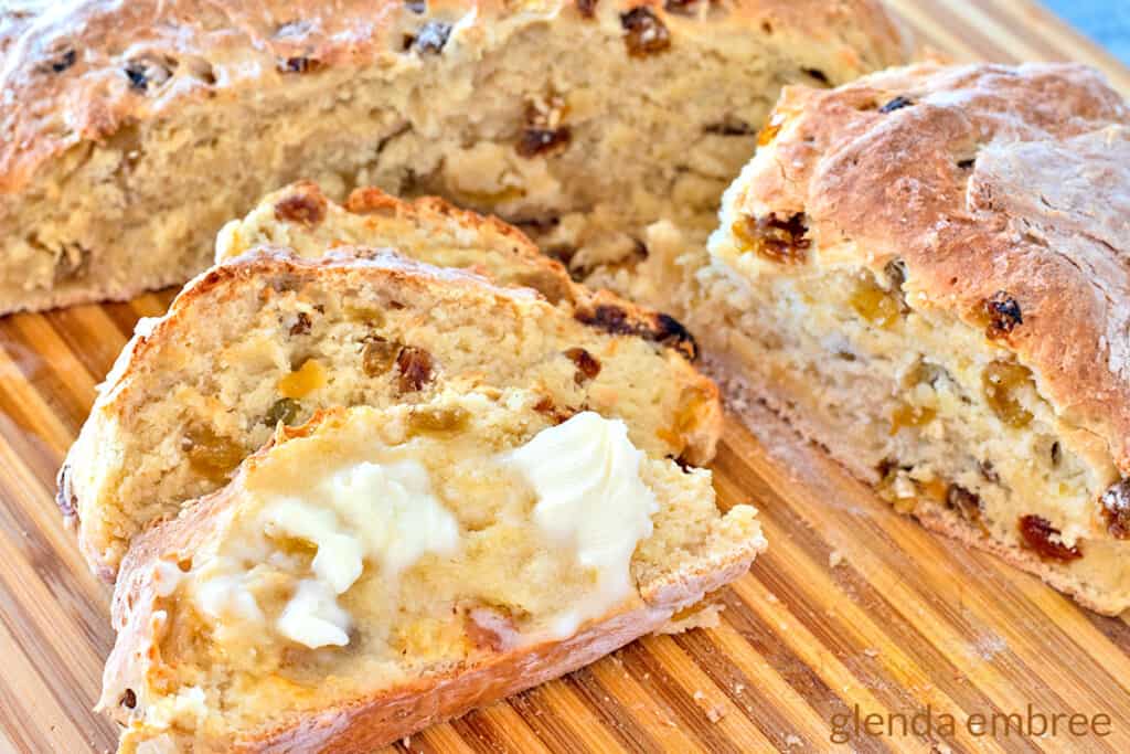 Irish soda bread with raisins on a cutting board - irish soda bread recipe